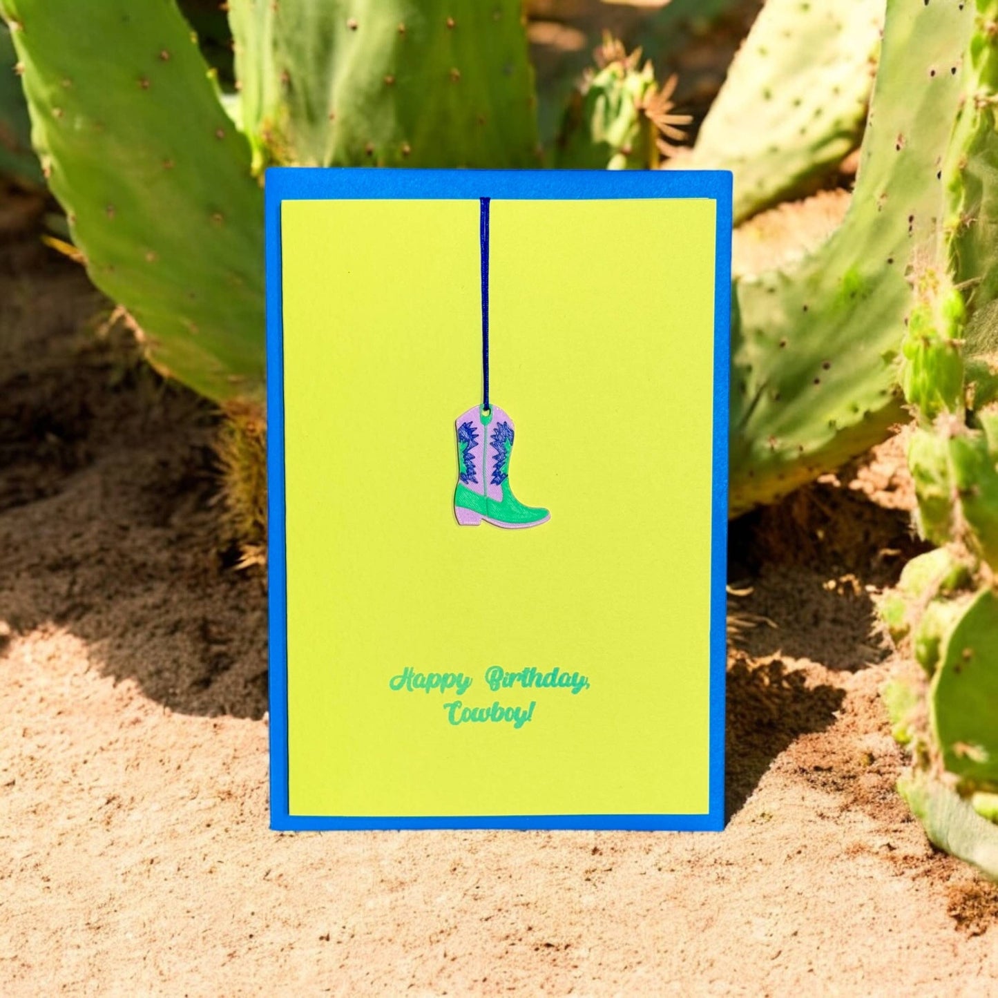 Pink Stories - Neon kaart met cadeauhanger Happy Birthday, Cowboy! blauw