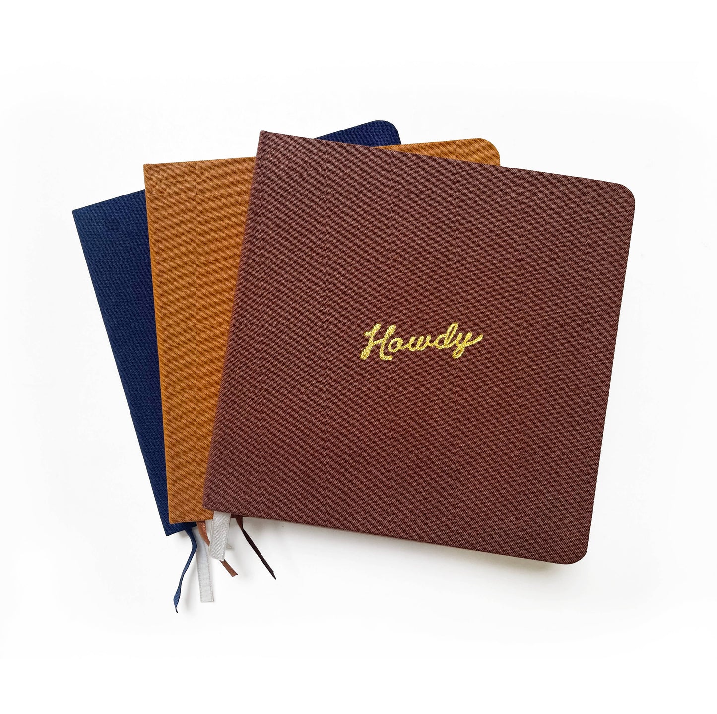 Portmanteau - Vierkant linnen notitieboek met reliëf Howdy goudfolie